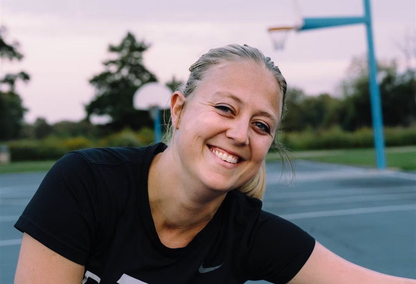 Bri smiling on the court
